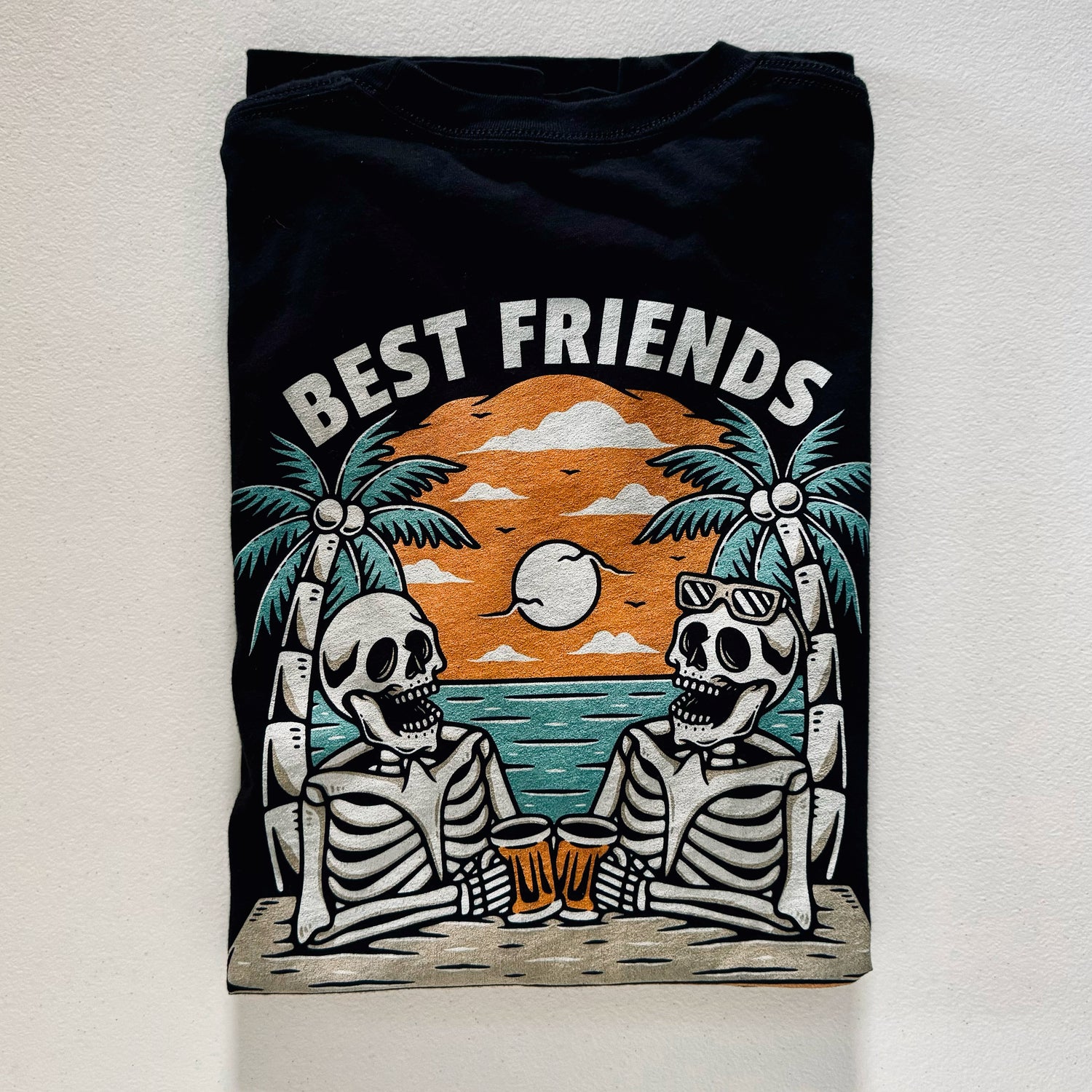 Best Friends folded tee design on a white background.